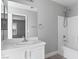 Clean bathroom with white vanity and bathtub at 8016 Roundup Ridge St, Las Vegas, NV 89131