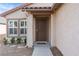 Front door with security door and walkway at 8016 Roundup Ridge St, Las Vegas, NV 89131