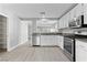 Modern kitchen with stainless steel appliances and white cabinets at 8016 Roundup Ridge St, Las Vegas, NV 89131