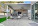 Outdoor kitchen and seating area under a covered patio at 8104 Via Del Cerro Ct, Las Vegas, NV 89117