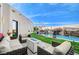 Luxury backyard with pool, waterfall, and seating area at 8104 Via Del Cerro Ct, Las Vegas, NV 89117