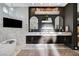 Elegant bathroom with double sinks, marble tile, and freestanding bathtub at 8104 Via Del Cerro Ct, Las Vegas, NV 89117