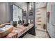 Spa-like bathroom with black vessel sink and marble countertop at 8104 Via Del Cerro Ct, Las Vegas, NV 89117