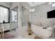 Modern bathroom with a glass shower and soaking tub at 8104 Via Del Cerro Ct, Las Vegas, NV 89117