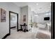 Bright bathroom with marble tile and a freestanding tub at 8104 Via Del Cerro Ct, Las Vegas, NV 89117