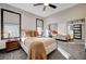 Relaxing bedroom with mirrored closet doors and neutral decor at 8104 Via Del Cerro Ct, Las Vegas, NV 89117