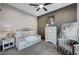 Guest bedroom with daybed, dresser, and seating area, offering a tranquil retreat at 8104 Via Del Cerro Ct, Las Vegas, NV 89117