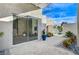 Private courtyard with sliding glass doors and modern landscaping at 8104 Via Del Cerro Ct, Las Vegas, NV 89117