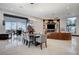 Open concept dining room with seating for 8 and views to the living room at 8104 Via Del Cerro Ct, Las Vegas, NV 89117