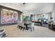 Bright dining area with modern table and chairs, adjacent to living space at 8104 Via Del Cerro Ct, Las Vegas, NV 89117