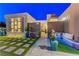 Front entry with modern lighting, a sitting area, and a pergola at 8104 Via Del Cerro Ct, Las Vegas, NV 89117