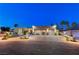 Luxury home with modern design, showcasing a spacious driveway and landscape at 8104 Via Del Cerro Ct, Las Vegas, NV 89117