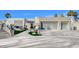 Modern home with a three-car garage and landscaped front yard at 8104 Via Del Cerro Ct, Las Vegas, NV 89117