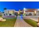 Modern home exterior with a water feature and landscaped walkway at 8104 Via Del Cerro Ct, Las Vegas, NV 89117