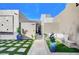 Inviting entryway with seating area and modern landscaping at 8104 Via Del Cerro Ct, Las Vegas, NV 89117