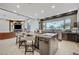 Gourmet kitchen featuring a large island with seating and high-end finishes at 8104 Via Del Cerro Ct, Las Vegas, NV 89117