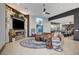 Living room with cozy seating and a modern fireplace at 8104 Via Del Cerro Ct, Las Vegas, NV 89117