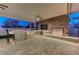 Modern outdoor kitchen with grill and bar at 8104 Via Del Cerro Ct, Las Vegas, NV 89117