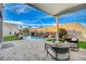 Covered patio overlooking the pool and yard at 8104 Via Del Cerro Ct, Las Vegas, NV 89117