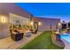 Relaxing patio with fire pit, seating area, and views of the pool at 8104 Via Del Cerro Ct, Las Vegas, NV 89117