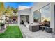 Outdoor patio with seating and built-in fire pit at 8104 Via Del Cerro Ct, Las Vegas, NV 89117