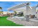 Backyard with pergola, water feature, and artificial turf at 8104 Via Del Cerro Ct, Las Vegas, NV 89117