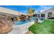 Luxury pool with waterfall and spa area at 8104 Via Del Cerro Ct, Las Vegas, NV 89117