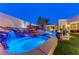 Stunning pool with waterfall feature and nighttime lighting at 8104 Via Del Cerro Ct, Las Vegas, NV 89117