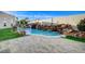 Resort-style pool with waterfall and spacious patio at 8104 Via Del Cerro Ct, Las Vegas, NV 89117