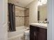 Clean bathroom with shower/tub combo and dark wood vanity at 8255 Las Vegas Blvd # 619, Las Vegas, NV 89123