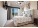 Comfortable bedroom with a ceiling fan and city views at 8255 Las Vegas Blvd # 619, Las Vegas, NV 89123