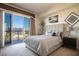 Bright bedroom with sliding glass door to balcony and city view at 8255 Las Vegas Blvd # 619, Las Vegas, NV 89123