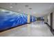 Elegant building hallway with blue water-themed wall art and polished floors at 8255 Las Vegas Blvd # 619, Las Vegas, NV 89123