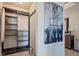 Large closet with shelves and a vintage Vegas poster at 8255 Las Vegas Blvd # 619, Las Vegas, NV 89123