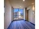 Hallway with elevator and large window overlooking city at 8255 Las Vegas Blvd # 619, Las Vegas, NV 89123