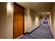 Building hallway with carpet and doors to individual units at 8255 Las Vegas Blvd # 619, Las Vegas, NV 89123