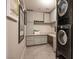 Modern laundry room with stacked washer/dryer and desk at 8255 Las Vegas Blvd # 619, Las Vegas, NV 89123