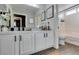 Clean bathroom with white cabinets and a large mirror at 8634 Lakota St, Las Vegas, NV 89123