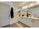 Elegant bathroom with dual sinks, a large shower, and modern fixtures at 8634 Lakota St, Las Vegas, NV 89123