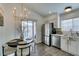 Bright kitchen with stainless steel appliances and white cabinets at 8634 Lakota St, Las Vegas, NV 89123