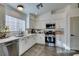 Modern kitchen with white cabinets, stainless steel appliances, and quartz countertops at 8634 Lakota St, Las Vegas, NV 89123