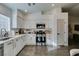 Modern kitchen with white cabinets, stainless steel appliances, and quartz countertops at 8634 Lakota St, Las Vegas, NV 89123