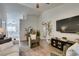 Spacious living room with hardwood floors, and a view of the kitchen at 8634 Lakota St, Las Vegas, NV 89123