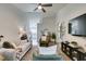 Modern living room with hardwood floors, ceiling fan, and stylish furniture at 8634 Lakota St, Las Vegas, NV 89123