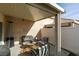 Covered patio with comfortable seating and a heater at 8634 Lakota St, Las Vegas, NV 89123