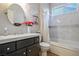 Bathroom with tub and dark vanity at 9016 Sundial Dr, Las Vegas, NV 89134