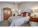 Spacious bedroom with ornate wood furniture and neutral color scheme at 9016 Sundial Dr, Las Vegas, NV 89134