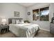 Bright bedroom with window and neutral decor at 9016 Sundial Dr, Las Vegas, NV 89134