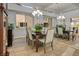 Elegant dining room with a large chandelier and mirrored wall at 9016 Sundial Dr, Las Vegas, NV 89134