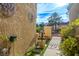 Inviting entryway with lush landscaping and decorative wall art at 9016 Sundial Dr, Las Vegas, NV 89134